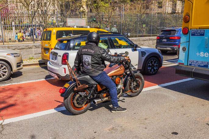 A man driving a motorcycle